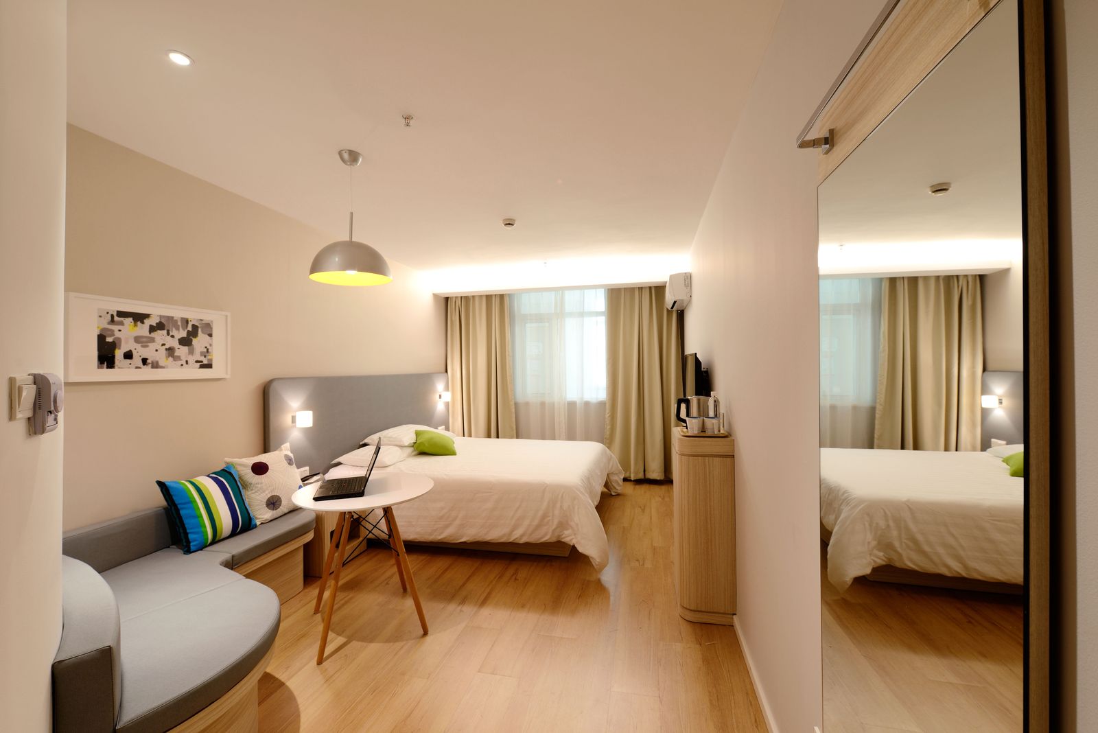 Contemporary hotel room with warm lighting